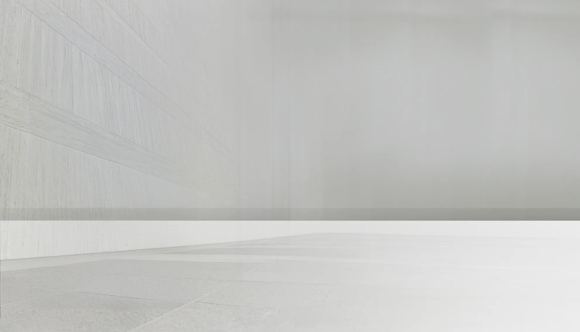 A man in a suit performing a dynamic dance move in a minimalist, bright space